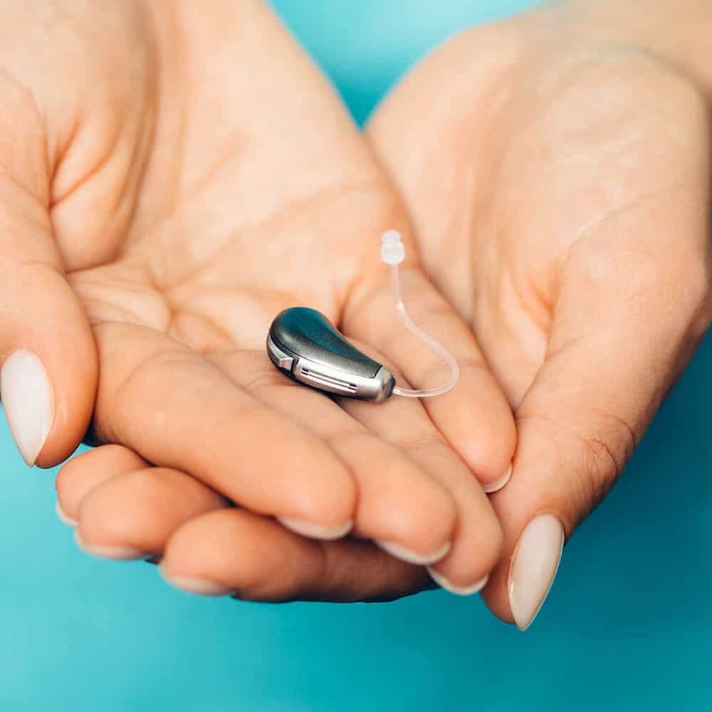 holding hearing aids