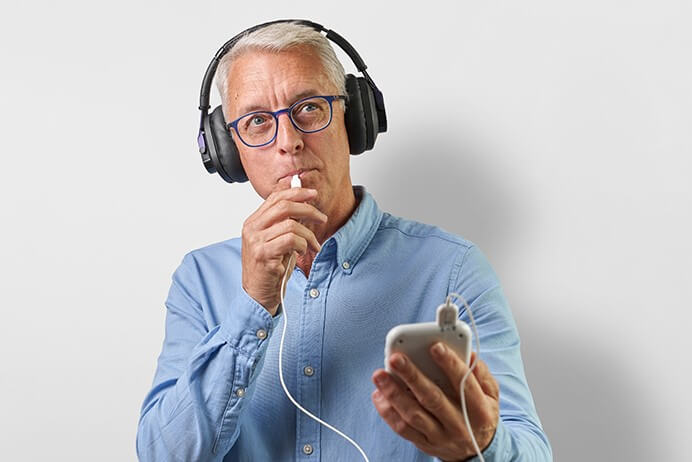 Older man holding smart phone