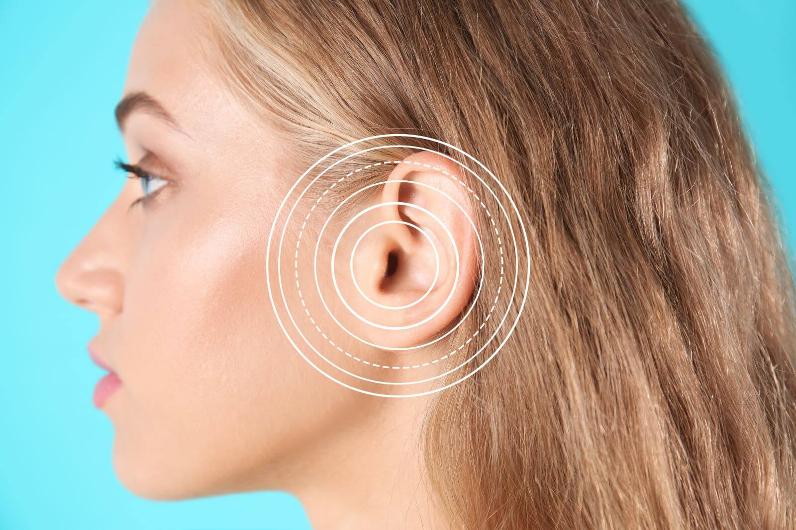 Side view of woman with circles overlaying her ear